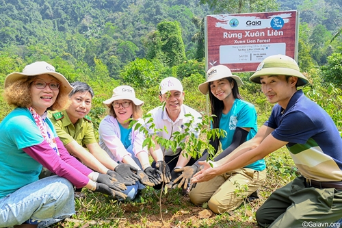 Miss H Hen Nie plants trees on World Planting Day