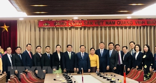 Секретарь парткома Ханоя господин Динь Тиен Зунг принял делегацию Вьентьяна