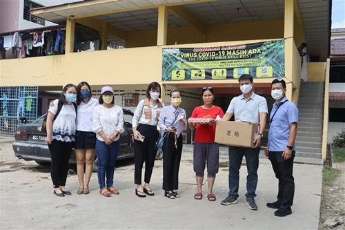 Apoyo a los vietnamitas afectados por las inundaciones en Malasia