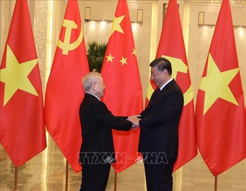 Ceremonia de recepción al secretario general del PCV en China