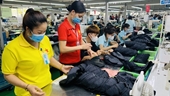 Expertos económicos pronostican​ un buen manejo de la inflación de Vietnam para el 2024